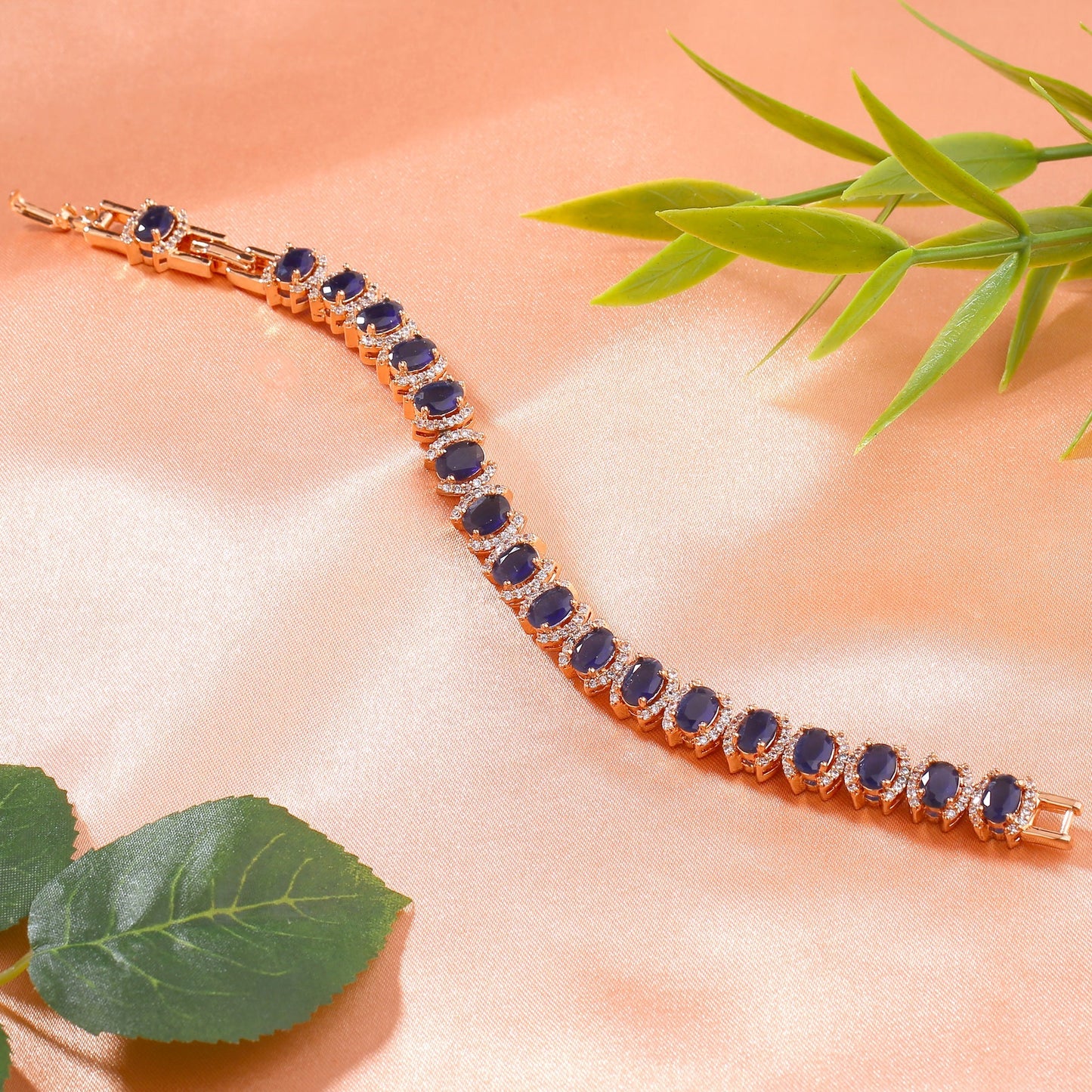 Estele Rose Gold-Polished CZ Ravishing Oval Designer Charm Bracelet with Blue American Diamonds for Women